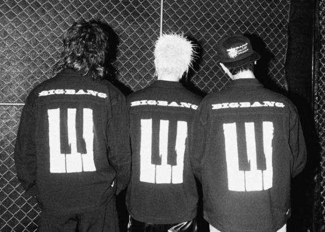 BIGBANG members displaying their individual styles in a unified group photo.